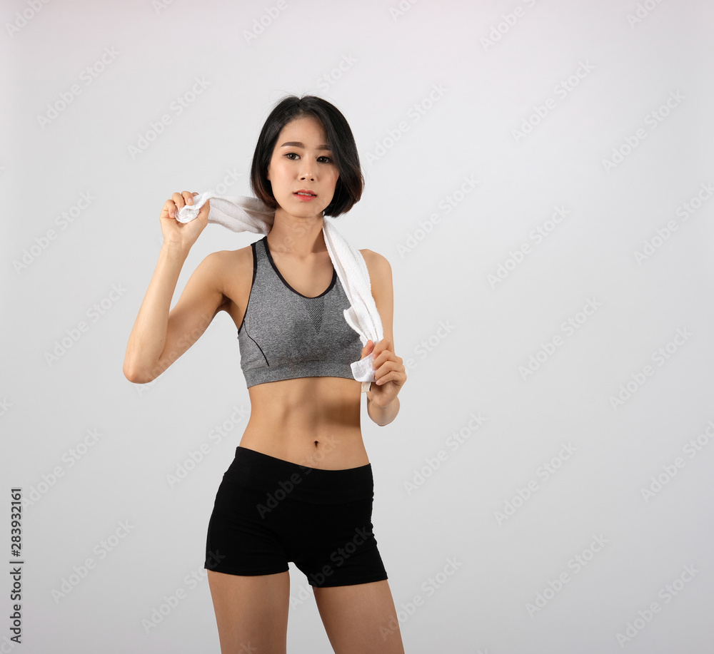 sporty fitness woman in sportswear with towel on white background. sporty fitness woman in sportswear with towel on white background.