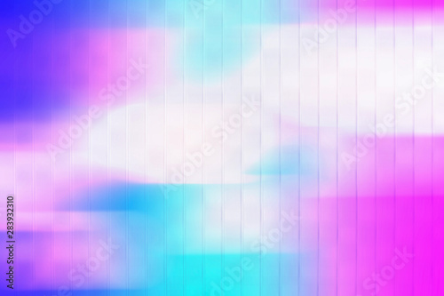 Colorful geometric blurred gradient mesh neon abstract blurred nature background. digitally generated image of blue light soft colored and stripes moving fast over texture background with copy space. © Phokin