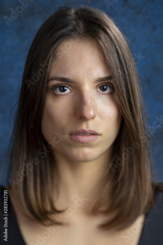 Studio portrait of a young girl showing beautiful eyelashes