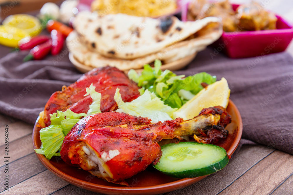 Traditional Indian food chicken tandoori and Tikka with garlic naan Traditional Indian food chicken tandoori and Tikka with garlic naan