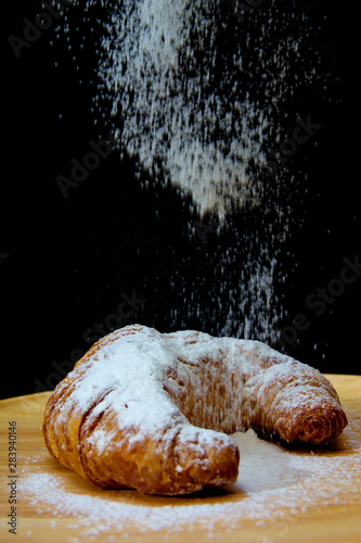 icing sugar falling  on Croissant