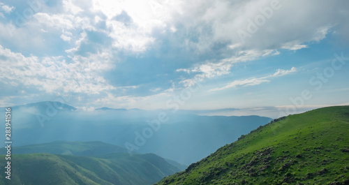 Amazing summer landscape, view to the green hills and beautiful sky photo