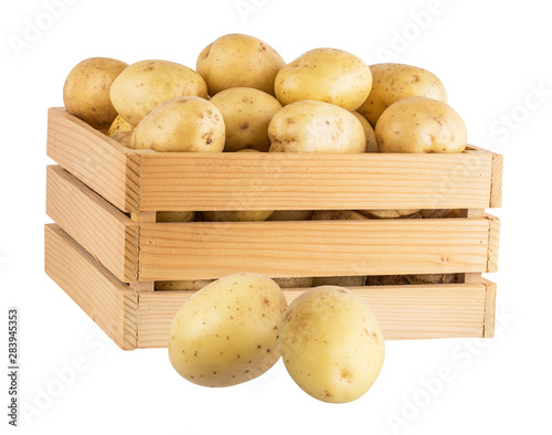 Fresh potatoes  in a wooden box isolated on white background  with clipping path