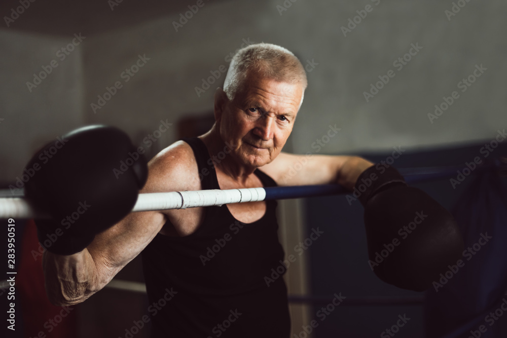 Senior man close up portrait with boxing activity Senior man close up portrait with boxing activity