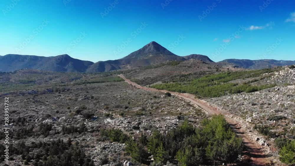 Dirt road amidst mountain landscape Dirt road amidst mountain landscape