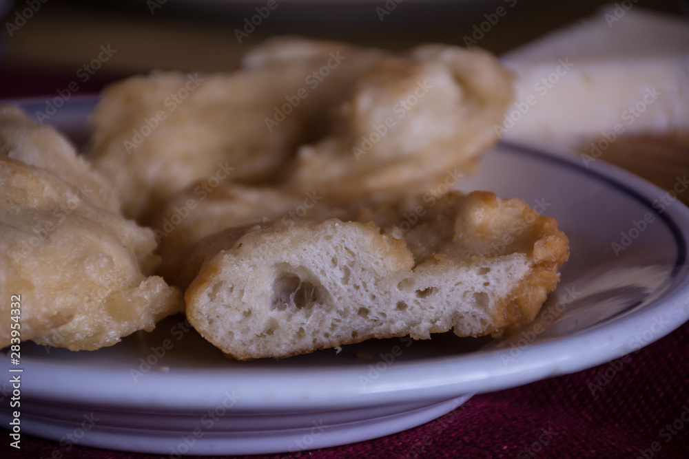 Close Up of Italian Traditional Food Called Frittelle, Made with Flour, Oil and Salt Close Up of Italian Traditional Food Called Frittelle, Made with Flour, Oil and Salt