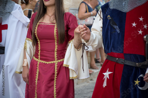 Close Up of Man and Woman Dressed with Medieval Traditional Clothes that Parade at Medieval Village Festival