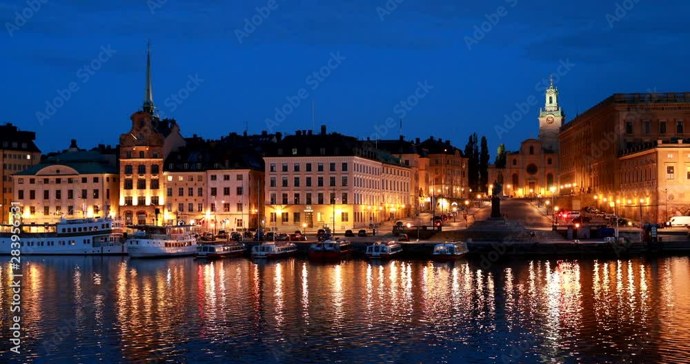 Stockholm, Sweden. Scenic Night View Of Embankment In Old Town Of Stockholm At Summer. Gamla Stan In Summer Evening. Famous Popular Destination Scenic Place And UNESCO World Heritage Site Stockholm, Sweden. Scenic Night View Of Embankment In Old Town Of Stockholm At Summer. Gamla Stan In Summer Evening. Famous Popular Destination Scenic Place And UNESCO World Heritage Site