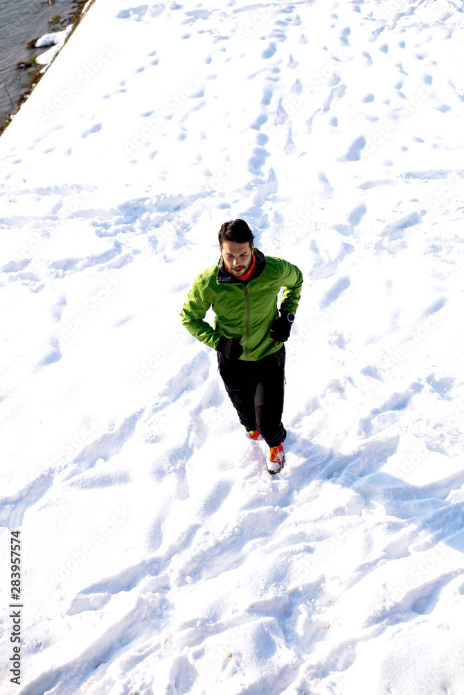 Athlete man training at snow