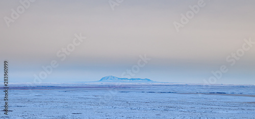 Distant view of the Sweet Grass Hills in northern Montana, USA, on a cold winter's evening photo