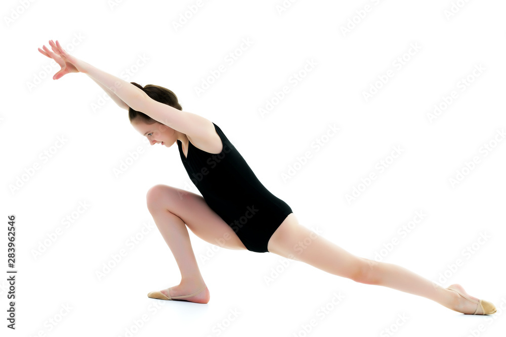 The gymnast perform an acrobatic element on the floor. The gymnast perform an acrobatic element on the floor.