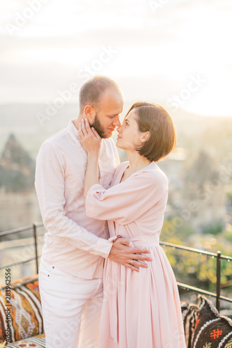 Tender couple hugging. Romantic young couple standing in mountain © smishura