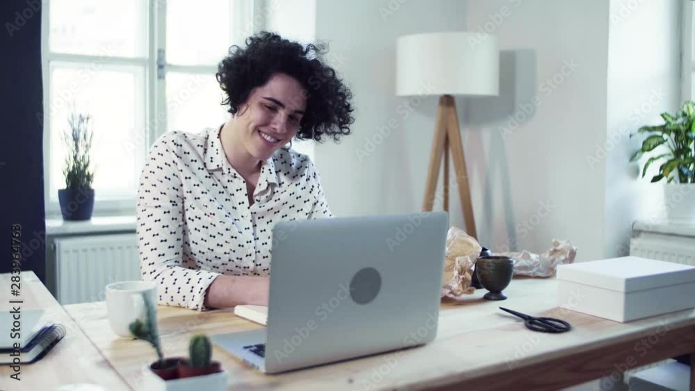 Young beautiful young woman working from home