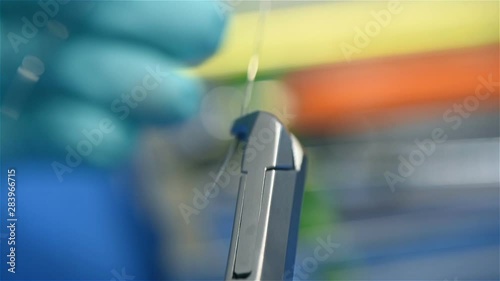 Dentist Cuts Arc On Patient Braces. Extreme Close Up. Slow Motion Effect