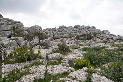 hill clouds ruins photo