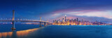 San Francisco Bay Bridge and San Francisco downtown in wide panorama photo