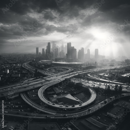 Los Angeles City aerial view to downtown with highway in foreground. Lots of traffic during rush hour