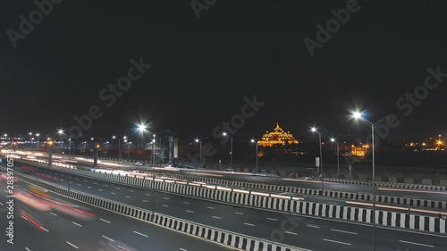 Time lapse of the Akshardham Temple during night with 8 lanes highway. photo