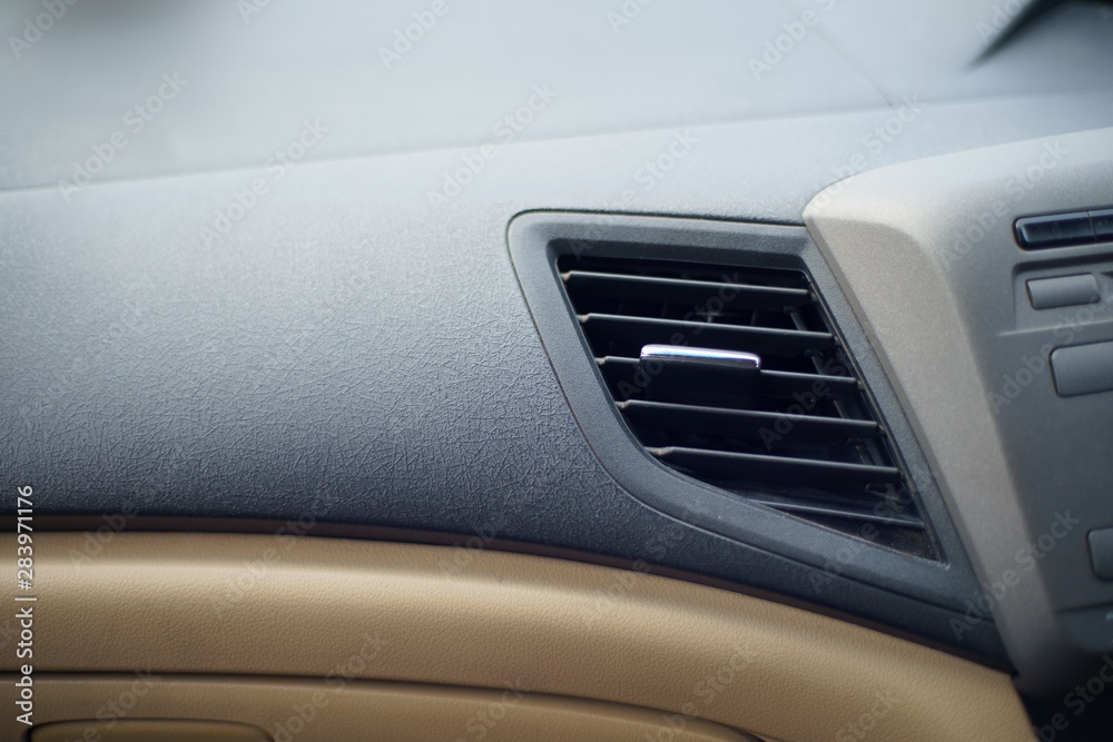 Car air conditioner grid panel on console Close up Car air conditioner grid panel on console Close up