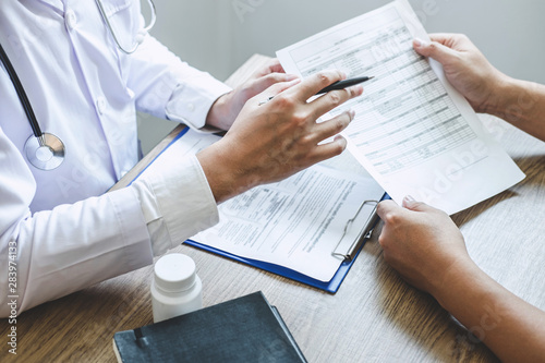 Professional doctor in white uniform gown coat and patient discussing consults to treatment of symptom disease and making prescriptions