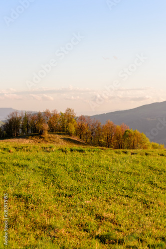 Apennines mountain landscape seen from the "Piana degli Ossi" at sunset time, a wide valley near Firenzuola, on the path of the Gods road or "la via degli Dei", in Italy