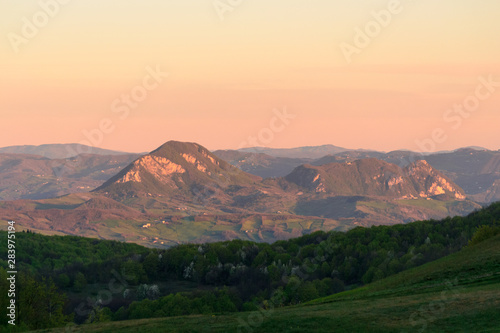 Apennines mountain landscape seen from the "Piana degli Ossi" at sunrise time in the morning, a wide valley near Firenzuola, on the path of the Gods road or "la via degli Dei", in Italy