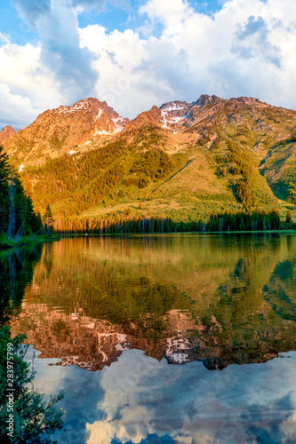 Fototapeta Naklejka Na Ścianę i Meble -  Morning Light on Mountains reflected in Lake
