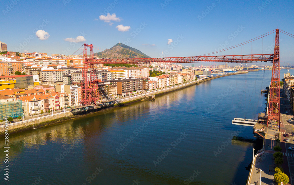 Aerial view of modern Vizcaya bridge crossing  river at Portugalete