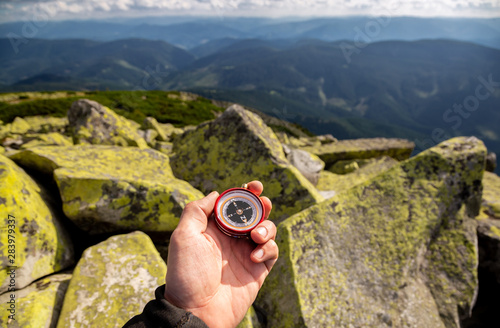 Schilderij op canvas Compass in the hands in the Carpathian mountains