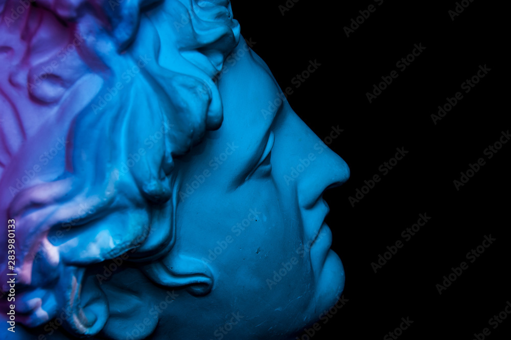 Gypsum copy of ancient statue Apollo head isolated on black background. Plaster sculpture man face. - obrazy, fototapety, plakaty 