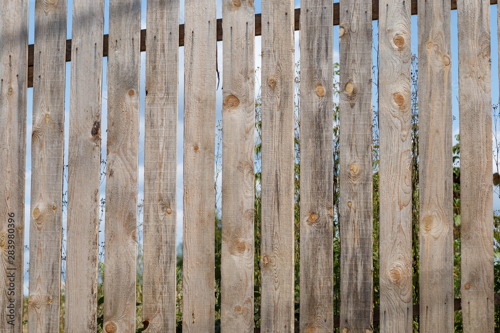 fragment of a Board fence,taken in daylight fragment of a Board fence,taken in daylight