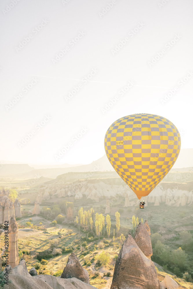 Panoramic view. Colorful hot air balloons flying over the valley at Cappadocia. Love Valley 