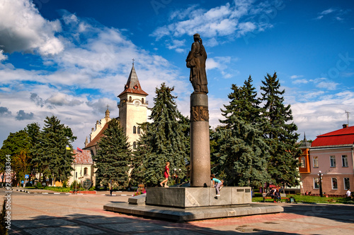 Statue of Roksolana Nastia Lisovska and Church of St. Nicholas and Anna in the center of the ancient city of Rohatyn, Ivano-Frankivsk region, Ukraine. August 2019 photo