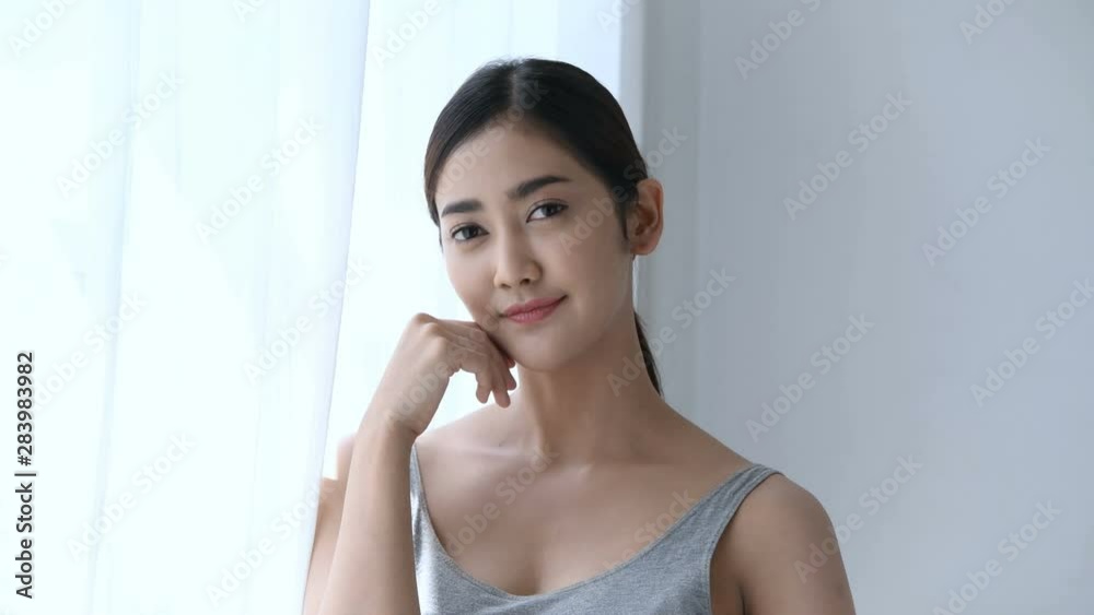 Holiday concept. Asian girls are fondling her face with tenderness. Holiday concept. Asian girls are fondling her face with tenderness.