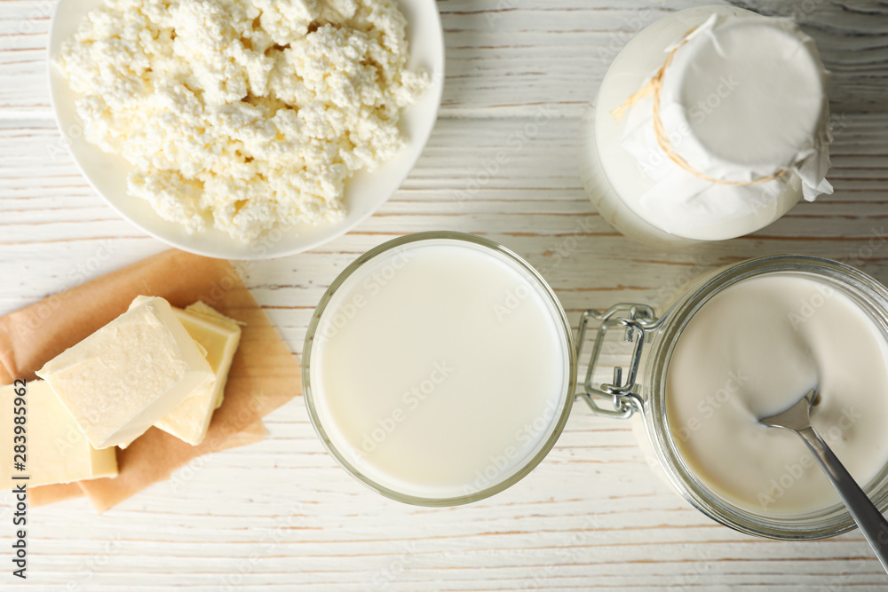 Different dairy products on white wooden background, top view Different dairy products on white wooden background, top view