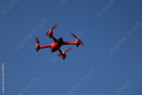red drone on a blue background