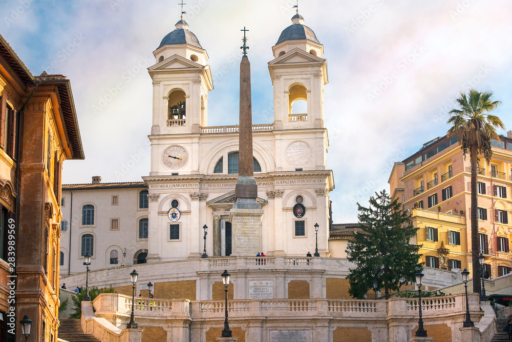 obelisk and church Trinita dei Monti on the top of the Spanish steps in Rome