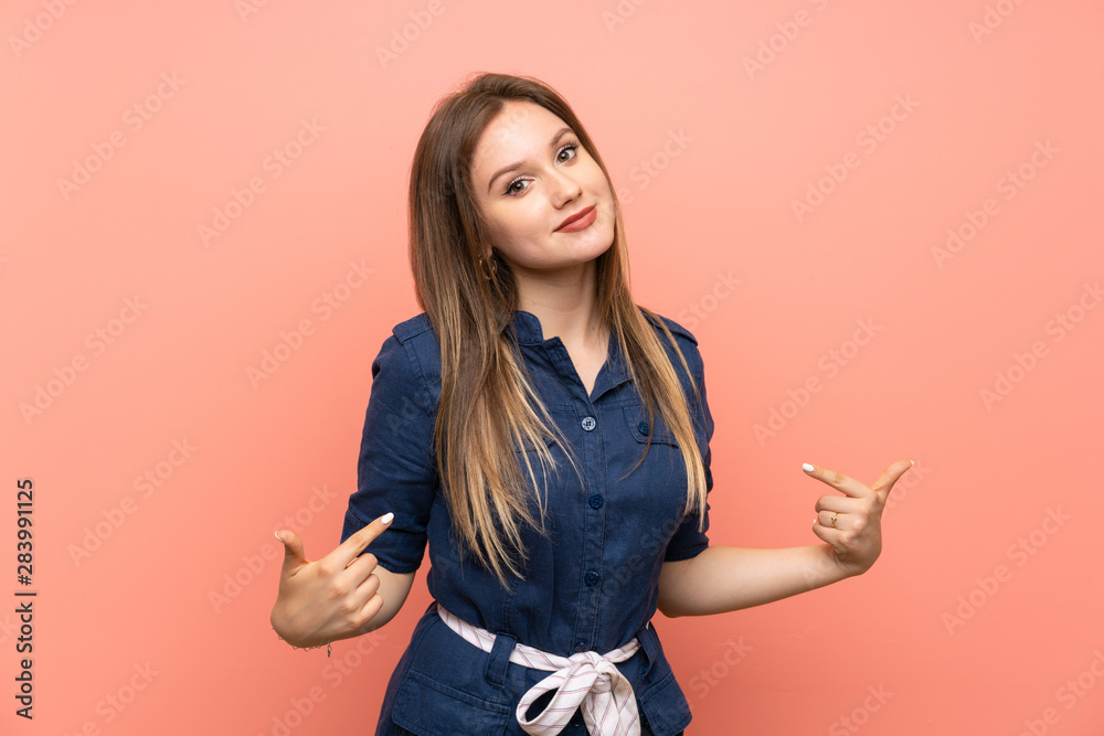 Teenager girl over isolated pink background proud and self-satisfied Teenager girl over isolated pink background proud and self-satisfied