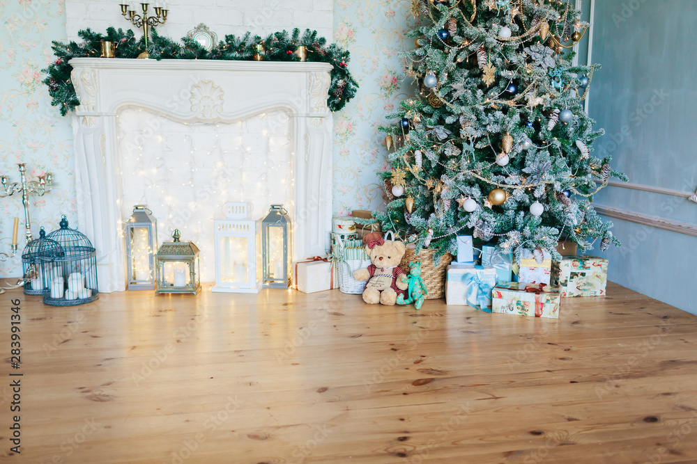 Obraz premium beautiful modern design of the room in delicate light colors decorated with Christmas tree and decorative elements