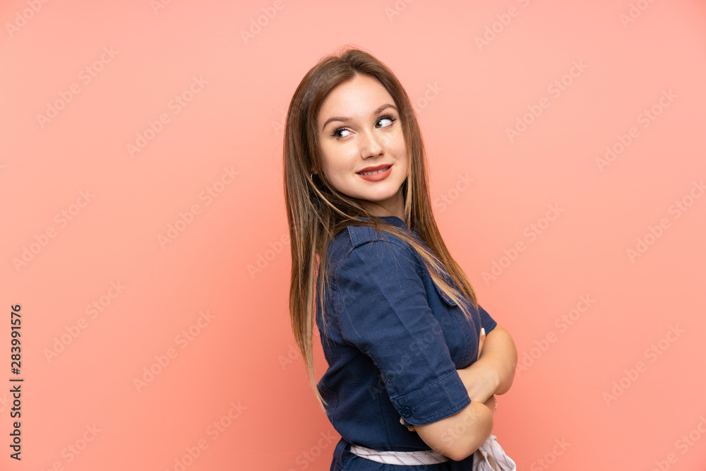 Teenager girl over isolated pink background with arms crossed and happy Teenager girl over isolated pink background with arms crossed and happy