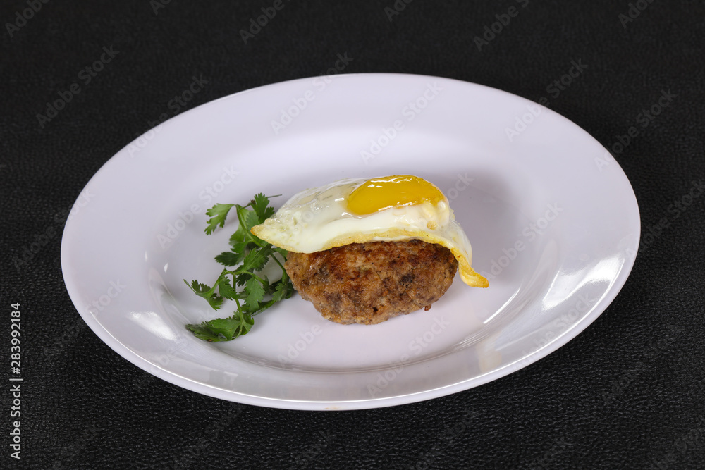 Beef cutlet with egg and coriander