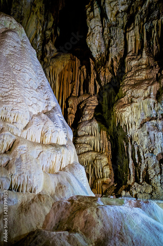 Walls covered with stalactites and stalagmites inside the cave 6 photo