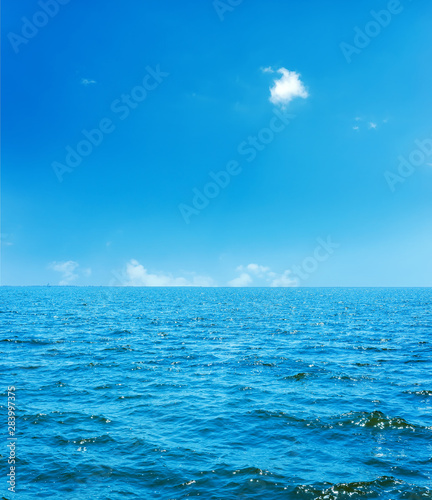 blue sea and sky with clouds