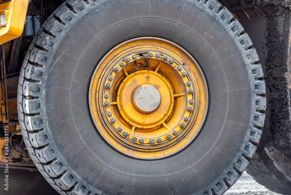 Big wheel of a mining truck. Big wheel of a mining truck.