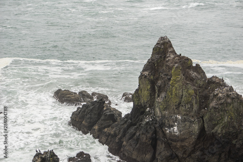 Tall black cliffs on the shore
