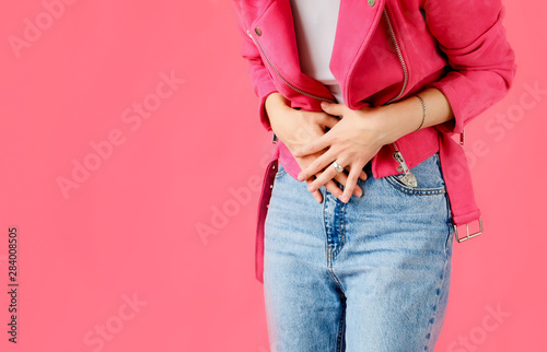 Stomach ache. Woman holds hands stomach. Menstrual pain or bowel problems. Pain. photo