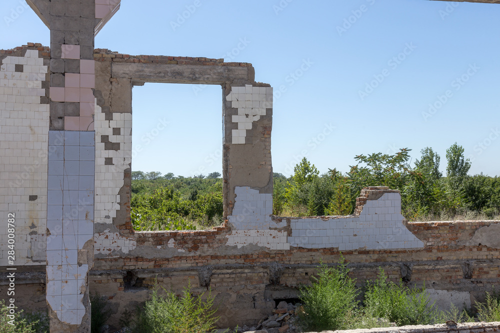 Ruined house. Remains of old houses. Apocalypse. Abandoned city. City of ghosts. Ruins of old historic houses destroyed by an earthquake and devastating operation of urban structures. Broken building