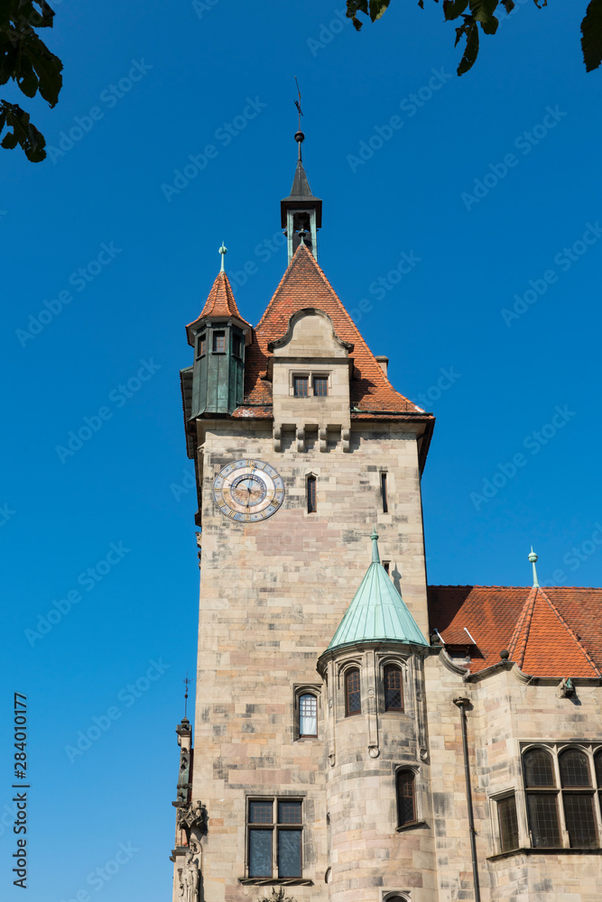 Fototapeta premium historical building with clock, towers and weather cock. Haguenau, France