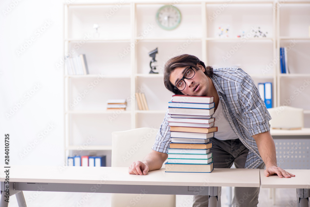 Young male student preparing for exams at home Young male student preparing for exams at home