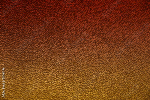 Texture of genuine leather. Gentle color leather texture closeup. Colorful background with gradient.